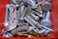 Screws, Nuts, Bolts and Nails in a Container Royalty Free Stock Photo