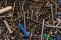 Screws, nuts, bolts, washers  lying on a wooden table Royalty Free Stock Photo