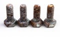 Screws old rusty nut with scale on white in row Royalty Free Stock Photo