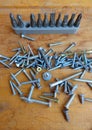 Screws and set of bits & heads on wood background Royalty Free Stock Photo