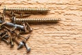 Screws on wooden background, closeup, construction concept Royalty Free Stock Photo