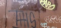 Scribbles, Doodles and Words in Graffiti on Brown Metal Door