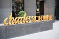 Charles Schwab golden lettering outside Manhattan office building