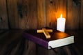 Scripture and cross symbolism Under the light of a candle Blessing from God with the power and power of holiness. It represents