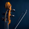 Scroll cello and fiddlestick Royalty Free Stock Photo