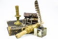 Scroll with a document, a glass inkwell with a feather, a chest with jewels and a large old book isolated on a white background Royalty Free Stock Photo