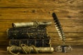 Scroll documents, old books and glass inkwell with pen on a  wooden background Royalty Free Stock Photo