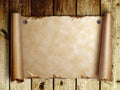 Scroll of old pape on wooden boards Royalty Free Stock Photo