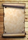 Scroll of old paper on wooden boards Royalty Free Stock Photo