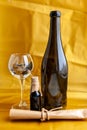 Scroll of paper with wine bootle and glass with coins on yellow background Royalty Free Stock Photo