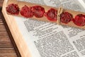 Scroll with seven seals on open holy bible book of revelation, a closeup