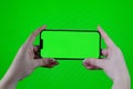 Scroll on Smartphone with Green Mock-up Screen Chroma Key. Phone green screen for product placement. Gestures on touch