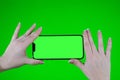 Scroll on Smartphone with Green Mock-up Screen Chroma Key. Phone green screen for product placement. Gestures on touch