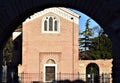 Scrovegni Chapel, illuminated by the sun, photographed through the arched vault of the ancient Roman walls in Padua.