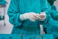 Scrub nurse prepare medical instruments for surgery