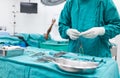 Scrub nurse preparing medical instruments for operation Royalty Free Stock Photo
