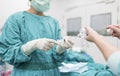 Scrub nurse preparing medical solution Royalty Free Stock Photo