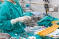 Scrub nurse preparing tools for open heart surgery Royalty Free Stock Photo