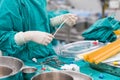 Scrub nurse preparing tools for open heart surgery