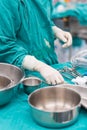 Scrub nurse preparing tools for operation Royalty Free Stock Photo
