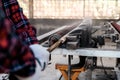 Scrub surface round of wood and sharpen with machine in the carpentry