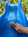 scrubbing brush cleaning on the slider of children's toys Royalty Free Stock Photo