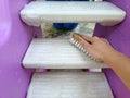 scrubbing brush cleaning on the stairs of children's toys Royalty Free Stock Photo
