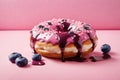 Blueberry filled doughnut on pink background