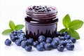 Scrumptious blueberry jam in a clear glass jar on white background with customizable text space