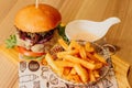 Scrumptious closeup of a hamburger and fries meal, prepared with fresh ingredients