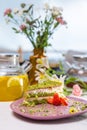 Scrumptious Green Cake with Strawberries on a Pink Plate