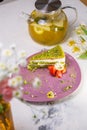 Scrumptious Green Cake with Strawberries on a Pink Plate