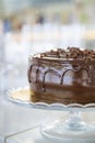 Scrumptious looking chocolate cake with dripping ganache frosting and simply decorated with dark chocolate shaving