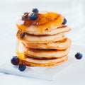 Scrumptious pancakes with honey and blueberries