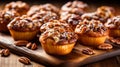 A scrumptious pecan pie muffin, filled with caramelized pecans and a buttery, flaky crust