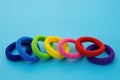 Scrunchies, Colored elastic baby hair ties, cotton hair kids ponytail holders, seamless hair bands on blue background