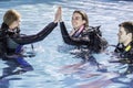 Scuba dive training in the pool with the instructor giving a high five Royalty Free Stock Photo