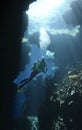 Scuba Diver in a cave with sunbeams