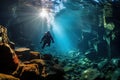 Scuba diver dives underwater in the ocean between coral reef