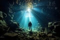 Scuba diver dives underwater in the ocean between coral reef