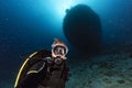 Scuba diver diving Ship Wreck in maldives indian ocean