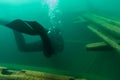 SCUBA diver entering the cabin trunk of wooden schooner shipwreck Royalty Free Stock Photo