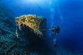 A scuba diver explores an sunken shipwreck in the Aegean Sea Royalty Free Stock Photo