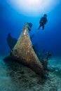 A scuba diver explores a sunken shipwreck at the seabed of the Aegean Sea Royalty Free Stock Photo