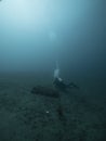 Scuba diver explores turquoise ocean depth of Philippines