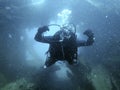 Scuba diver exploring the inside underwater shipwreck Royalty Free Stock Photo