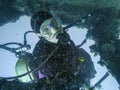 Scuba diver exploring the inside underwater shipwreck Royalty Free Stock Photo