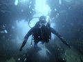 Scuba diver exploring the inside underwater shipwreck Royalty Free Stock Photo