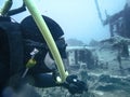 Scuba diver exploring underwater shipwreck