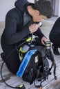 Scuba diver kitting up and checking his gear Royalty Free Stock Photo